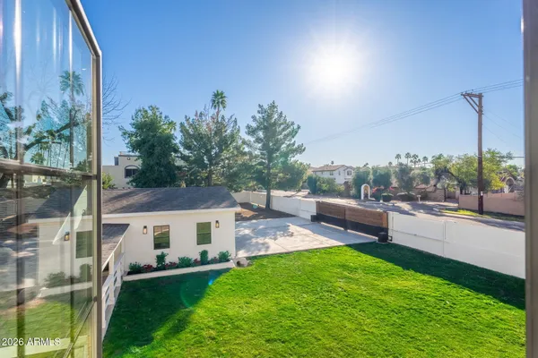 a spacious bedroom with a bed and a window