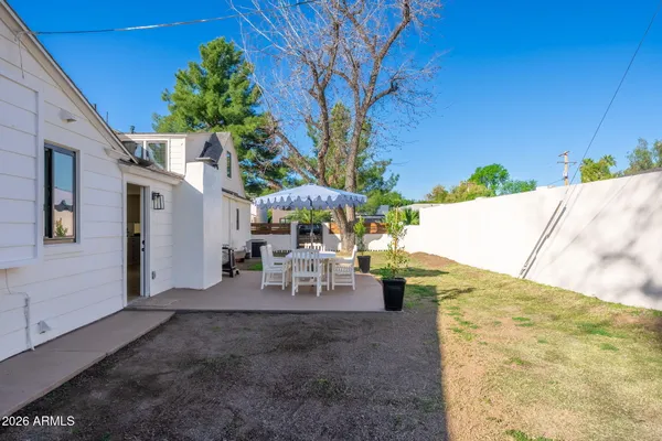 an aerial view of house with yard swimming pool and outdoor seating