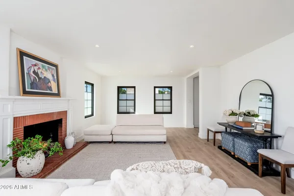 a living room with furniture and a fireplace