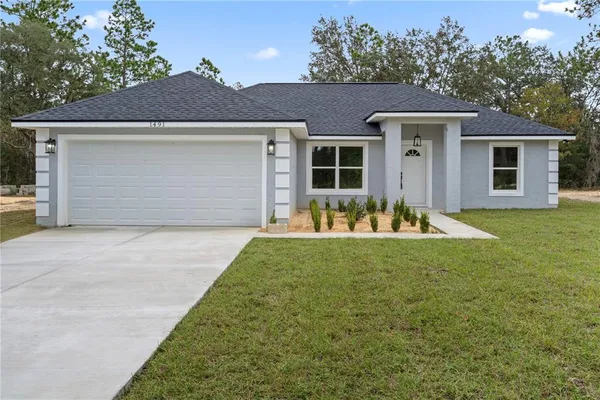 front view of a house and a yard