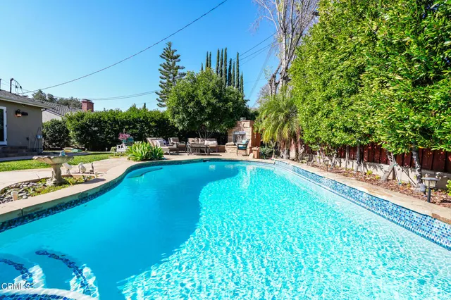 a view of a swimming pool with lounge chair