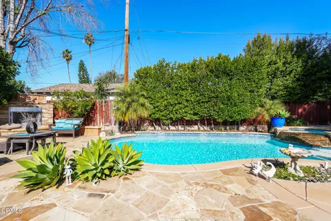 a view of a garden with a bench in a garden