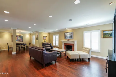 a living room with furniture flat screen tv and fireplace