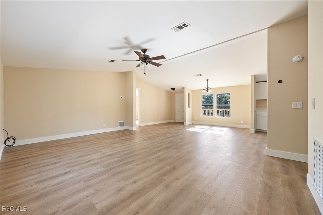250 Trader Road LaBelle, FL 33935 - Photo 20 of 42 wooden floor in an empty room with a window