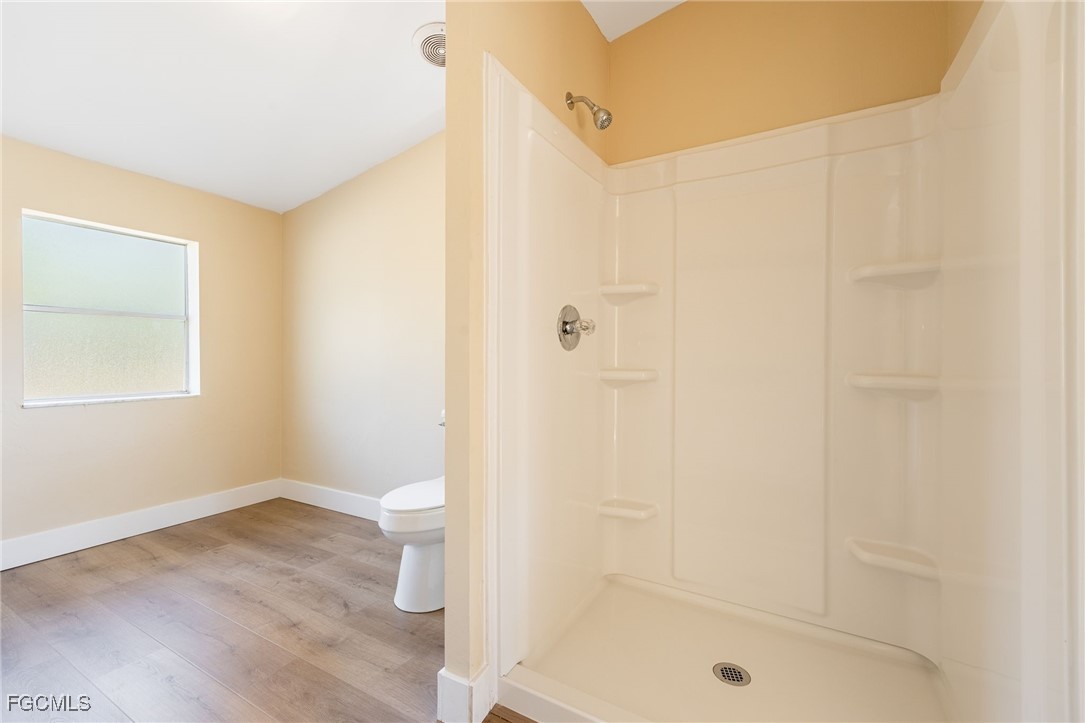 250 Trader Road LaBelle, FL 33935 - Photo 24 of 42 a bathroom with a shower and a toilet