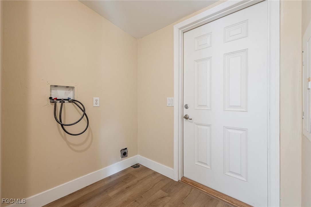 250 Trader Road LaBelle, FL 33935 - Photo 33 of 42 a bathroom with a glass shower door with a vanity