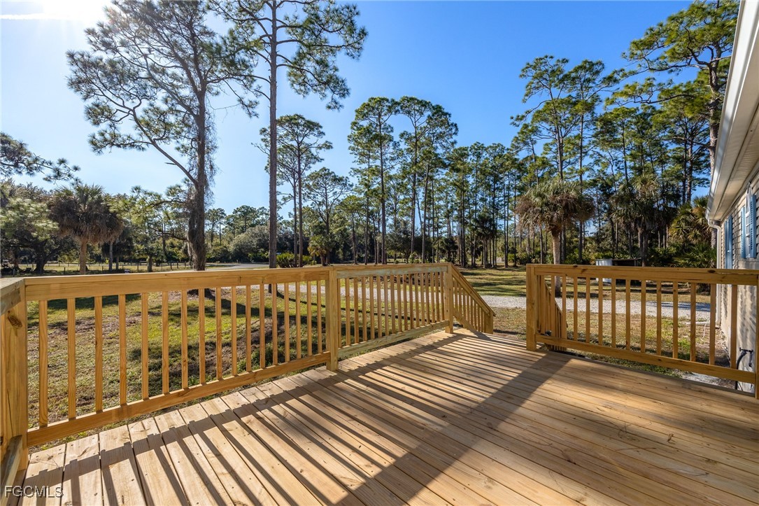 250 Trader Road LaBelle, FL 33935 - Photo 6 of 42 a view of balcony with wooden floor and fence