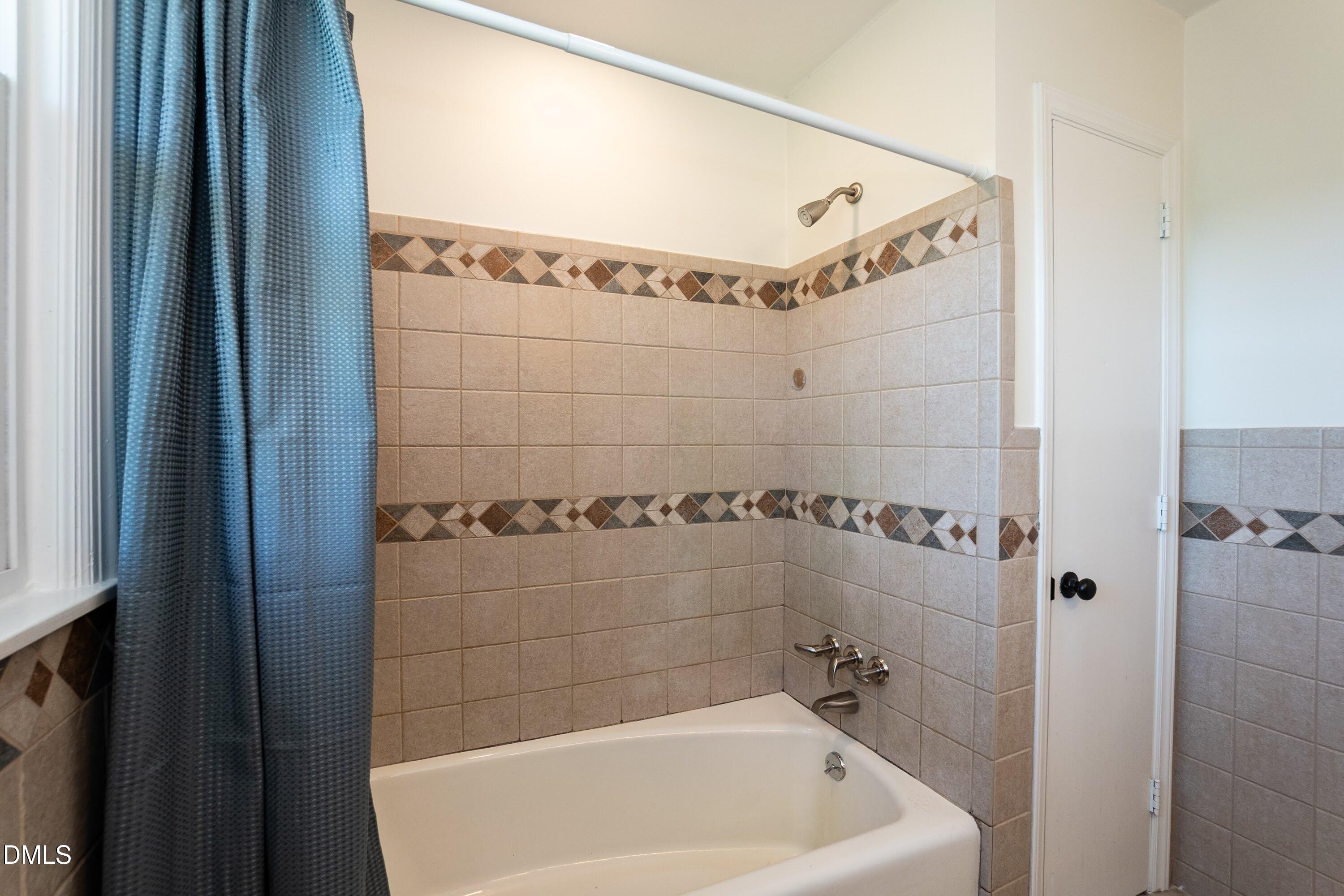 641 Rocky Ford Road Louisburg, NC 27549 - Photo 20 of 38 a bathroom with a bathtub