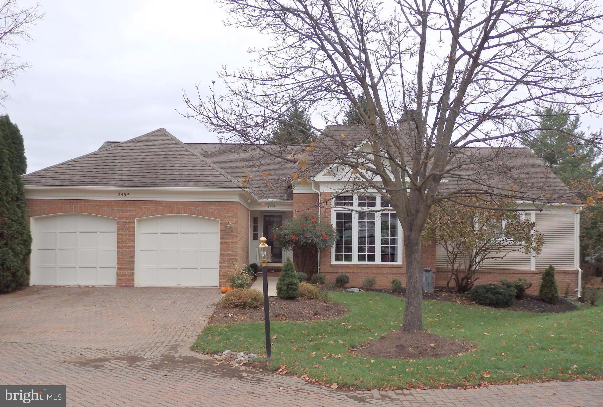 2454 Bear Den Road Frederick, MD 21701 - Photo 1 of 30 a front view of a house with a yard and garage