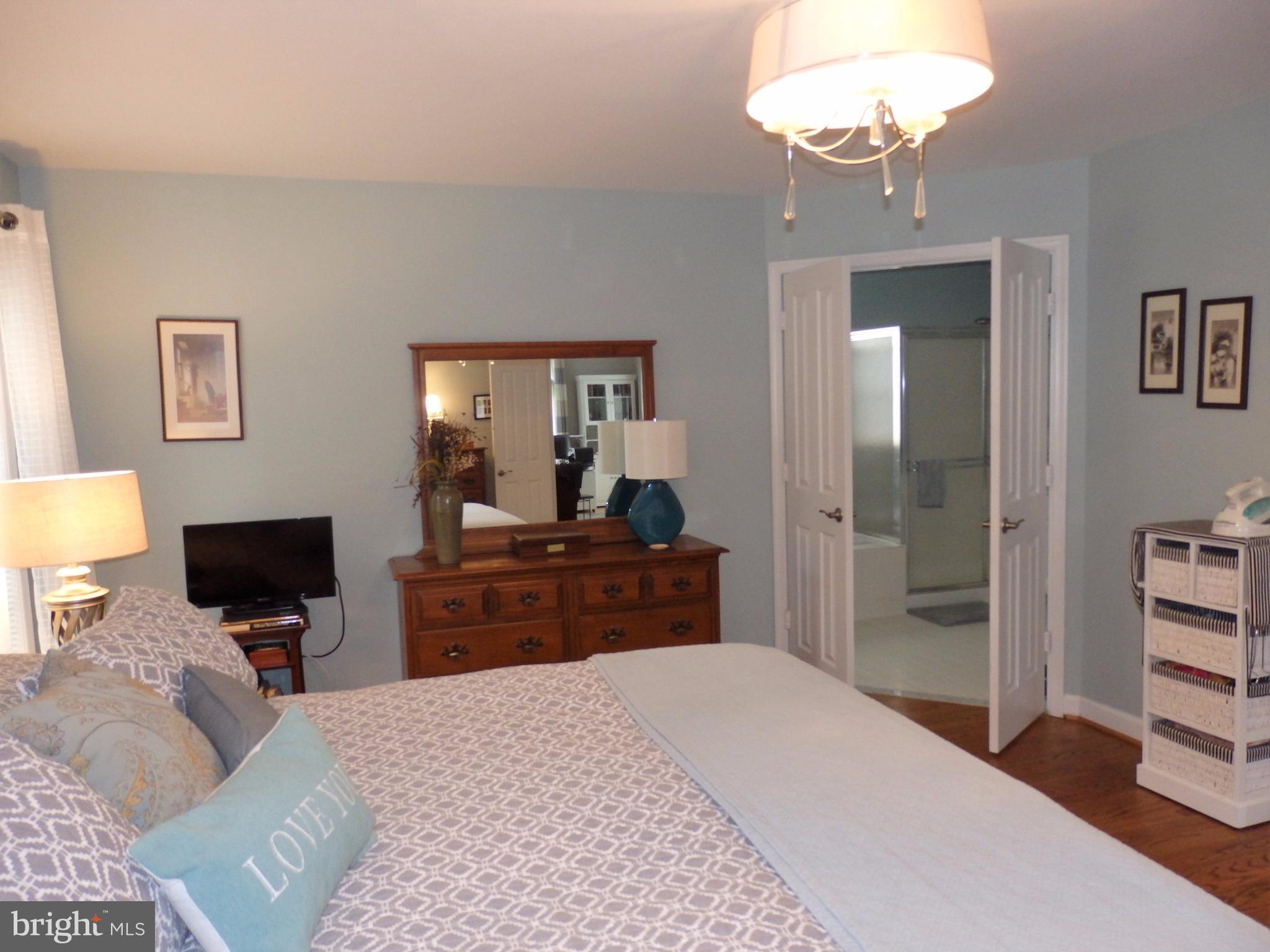 2454 Bear Den Road Frederick, MD 21701 - Photo 14 of 30 a bed room with a bed and a television