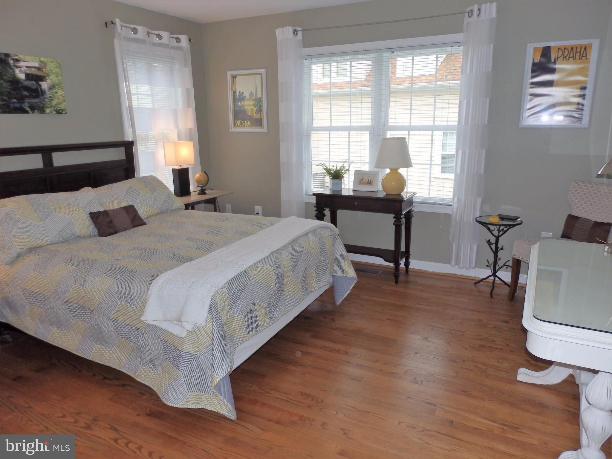 2454 Bear Den Road Frederick, MD 21701 - Photo 17 of 30 a bedroom with a bed and a table in it