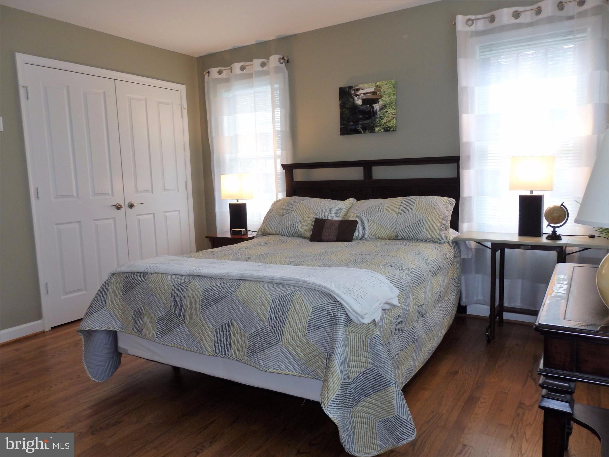 2454 Bear Den Road Frederick, MD 21701 - Photo 18 of 30 a bedroom with a bed and wooden floor