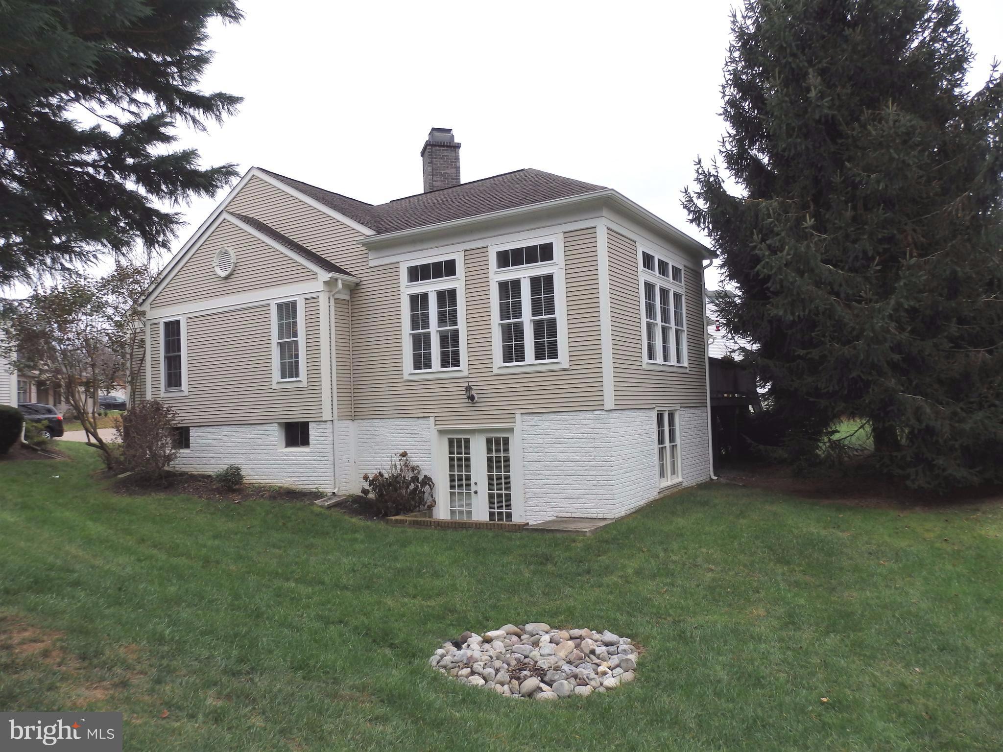 2454 Bear Den Road Frederick, MD 21701 - Photo 24 of 30 a front view of a house with a garden