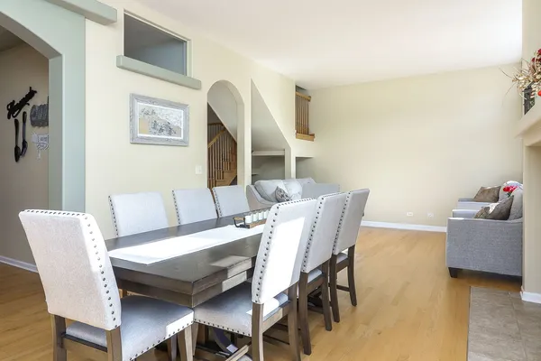 a view of a dining room with furniture and wooden floor