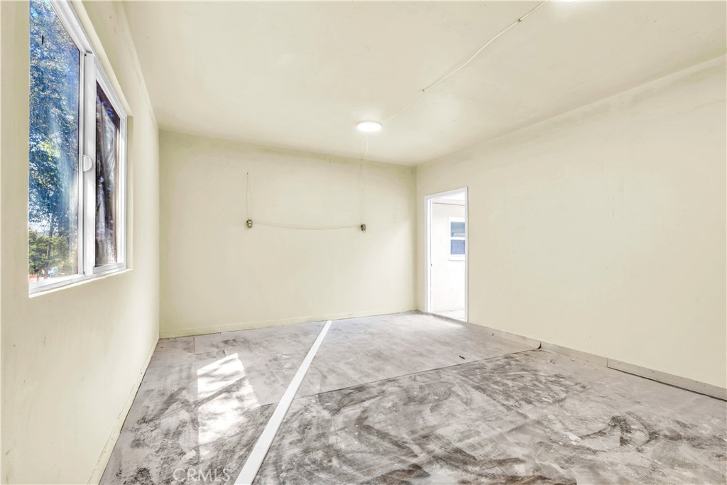 15905 Kugelman Street Lower Lake, CA 95457 - Photo 45 of 75 a view of a big room with wooden floor and windows