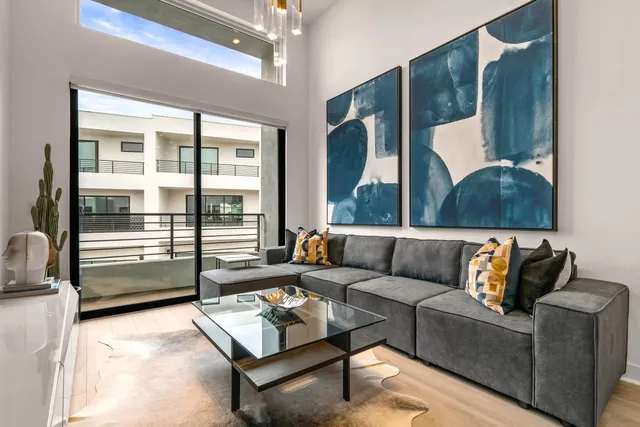 a view of a hallway with paintings on the wall