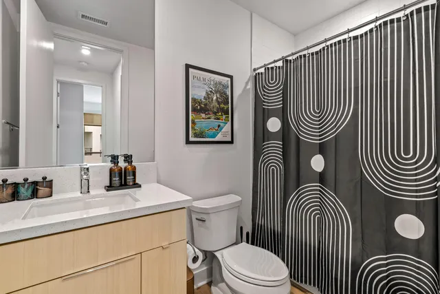 a bedroom with a bed and a table