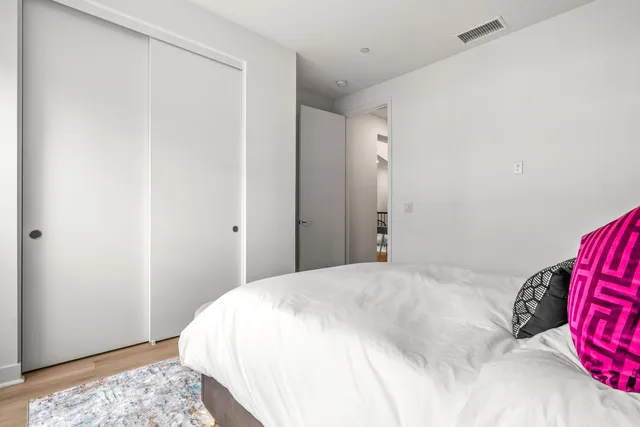 a bedroom with a large bed and a view of bedroom