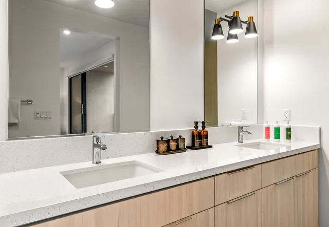 a bathroom with a bathtub a shower a sink and a mirror