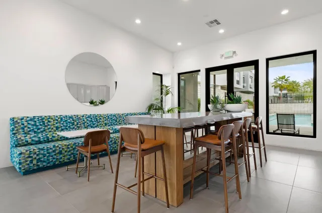 a view of a patio with swimming pool table and chairs