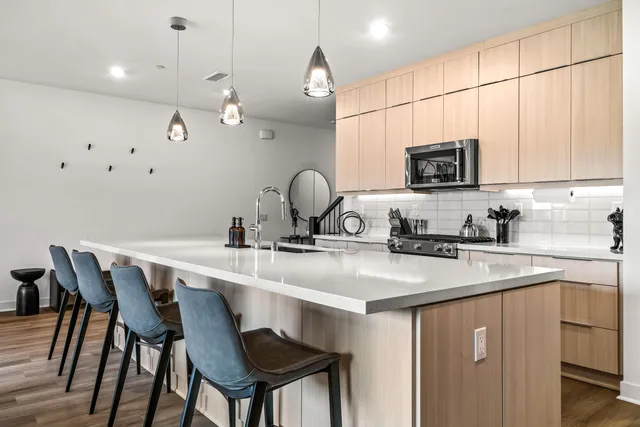 a kitchen with a sink cabinets and microwave