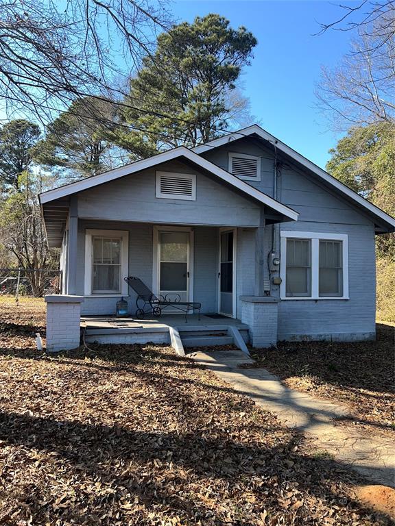 205 Sterling Street Minden, LA 71055 - Photo 1 of 1 a front view of a house with a yard