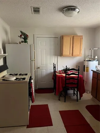 a room with furniture a rug and a window