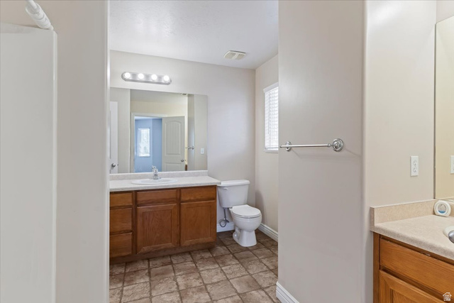2350 South Highway 89, Unit 4 Perry, UT 84302 - Photo 26 of 30 Bathroom with vanity and stone finish flooring