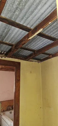 a stove top oven sitting inside of a kitchen