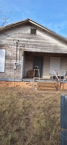 a view of a room with wooden cabinets