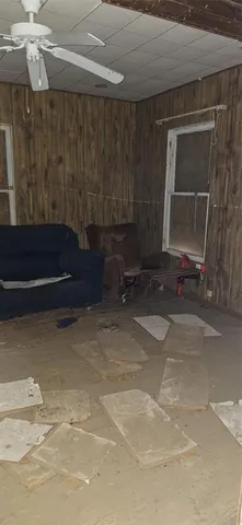 a bathroom with a granite countertop shower and a sink