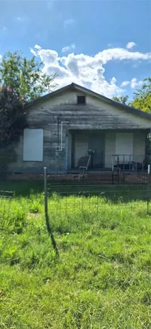 a view of a backyard with potted plants