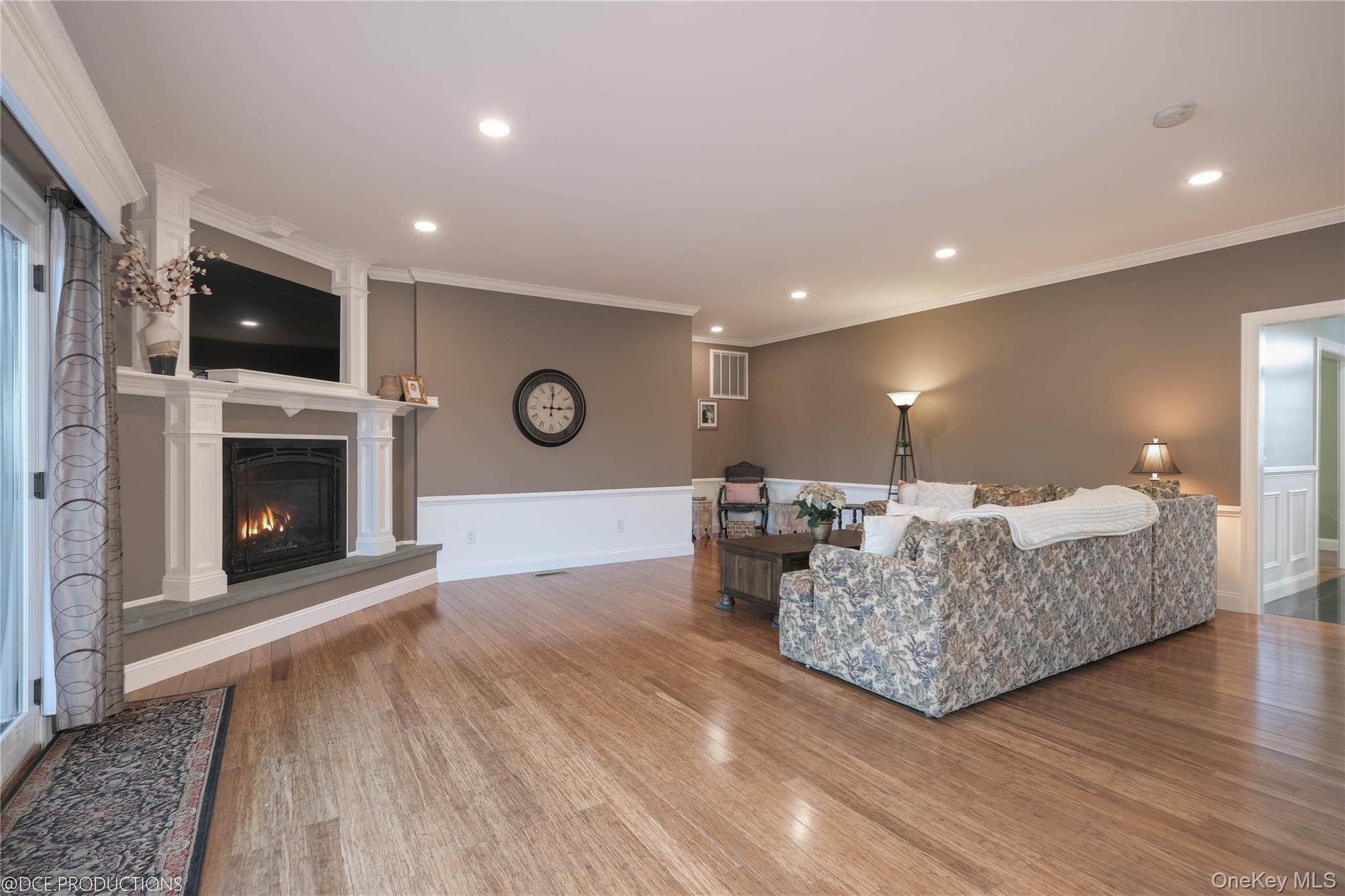 163 Hapeman Hill Road Red Hook, NY 12571 - Photo 15 of 50 Living room featuring ornamental molding, a gas fireplace, wood finished floors, recessed lighting, and space to gather.