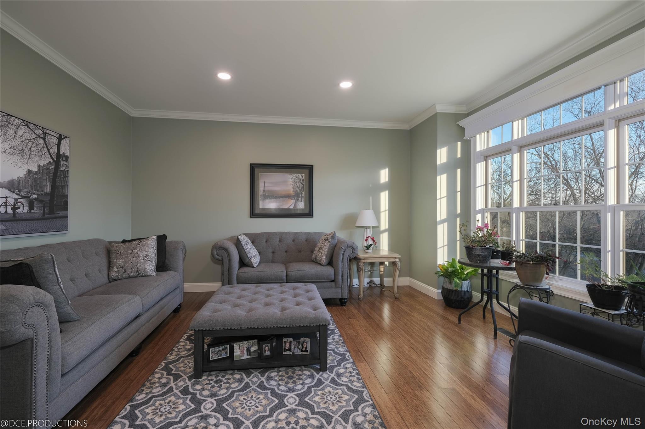 163 Hapeman Hill Road Red Hook, NY 12571 - Photo 20 of 50 Peaceful, separate family room with hardwood flooring, ornamental crown molding, large windows and recessed lighting.