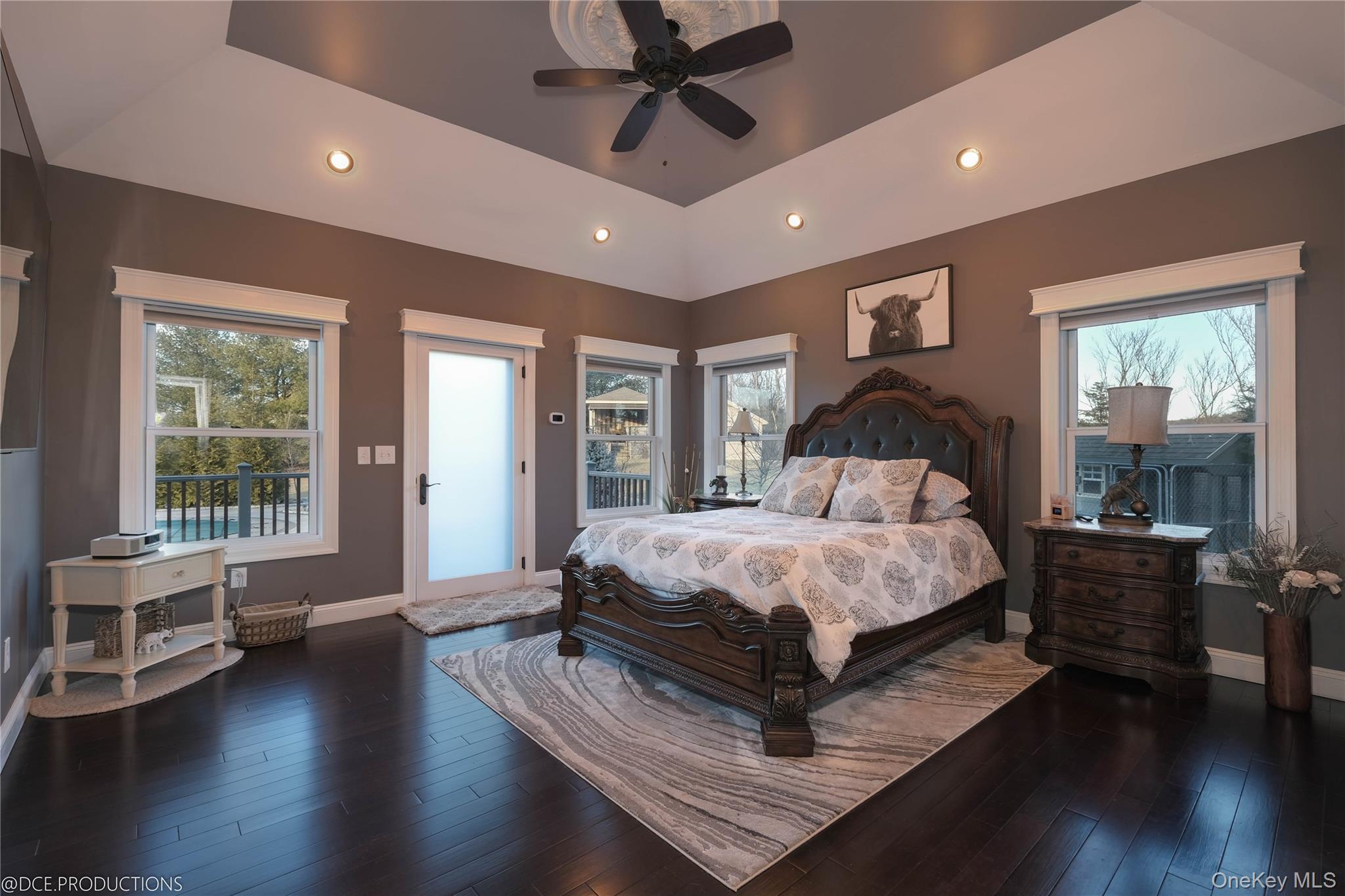163 Hapeman Hill Road Red Hook, NY 12571 - Photo 21 of 50 Main level Primary Bedroom suite with tray ceiling, hardwood floors, natural light, recessed lighting and direct access to rear deck.
