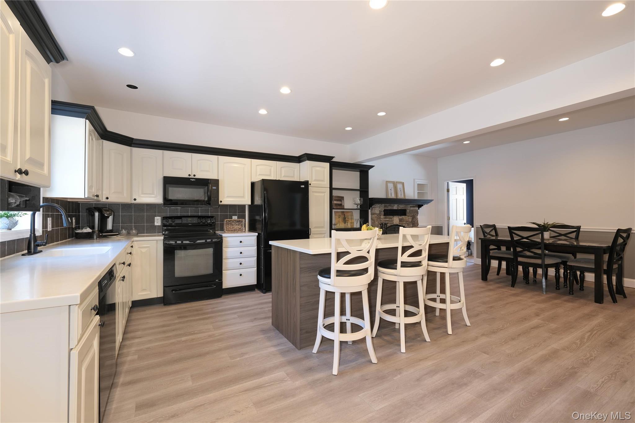 163 Hapeman Hill Road Red Hook, NY 12571 - Photo 42 of 50 Black appliances, floating island bar and tasteful backsplash.