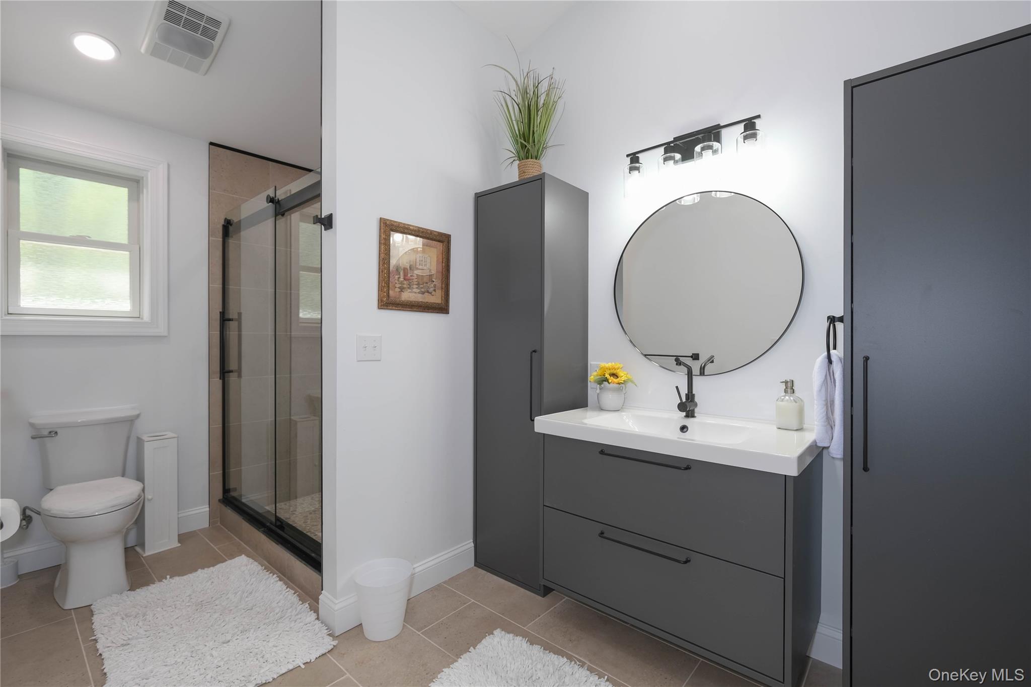 163 Hapeman Hill Road Red Hook, NY 12571 - Photo 45 of 50 Full bath featuring tile floors, tiled and glass shower, and stylish vanity.