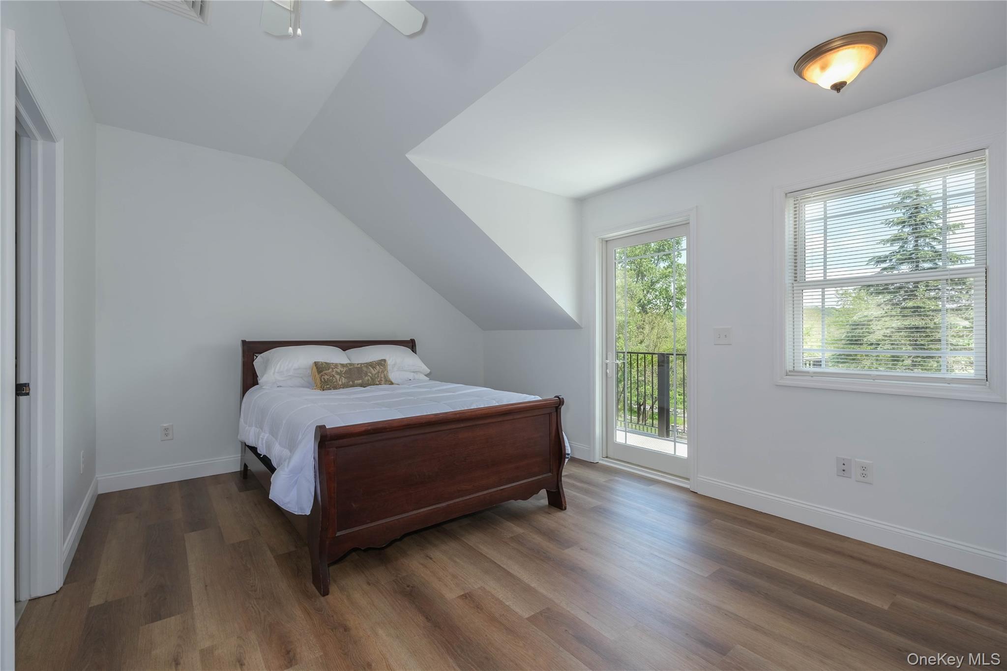 163 Hapeman Hill Road Red Hook, NY 12571 - Photo 46 of 50 Bedroom featuring access to Juliet balcony, engineered wood flooring, high ceilings and ensuite bath.