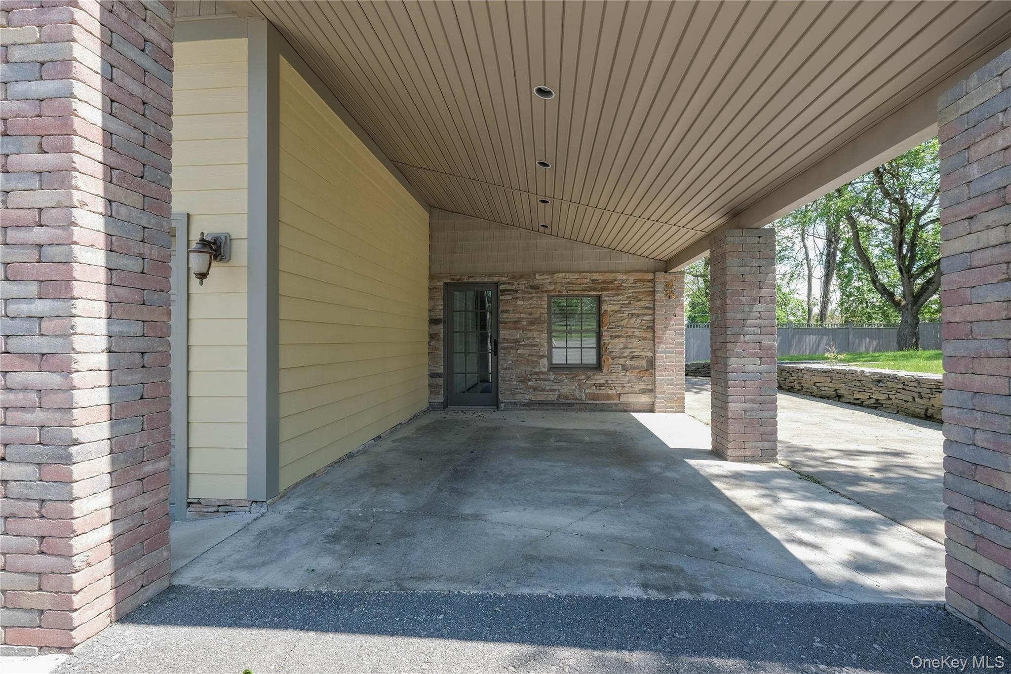 163 Hapeman Hill Road Red Hook, NY 12571 - Photo 48 of 50 View of patio / terrace with a carport and landscaped side yard.