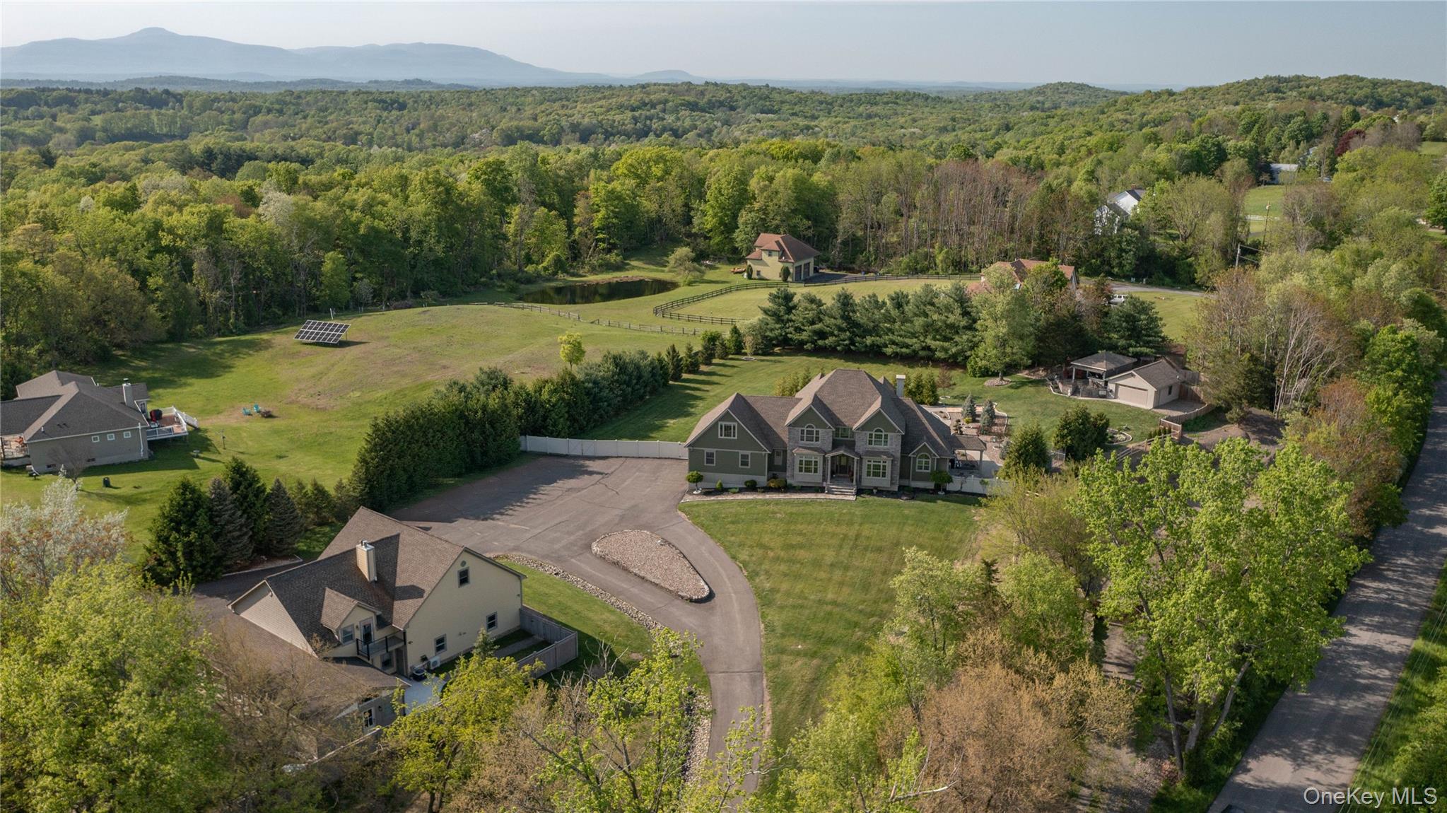 163 Hapeman Hill Road Red Hook, NY 12571 - Photo 5 of 50 Aerial view of property showing primary residence, guest house and tree-lined privacy boundary.