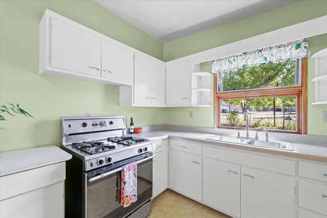 a view of a room with a ceiling fan
