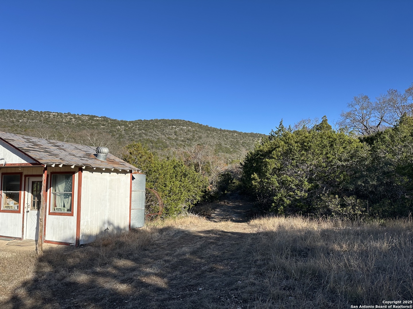 Lot 96 Black Jack Hollow Utopia, TX 78884 - Photo 13 of 20 a view of a house with a yard