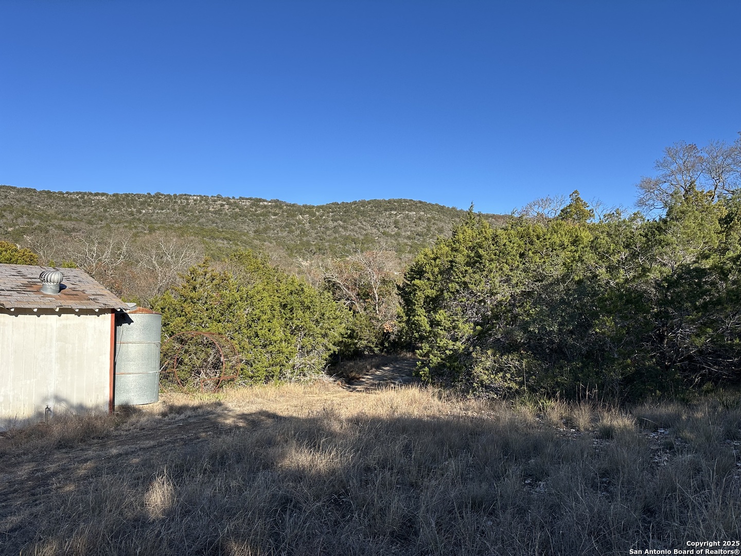 Lot 96 Black Jack Hollow Utopia, TX 78884 - Photo 10 of 20 a view of a large building with a mountain in the background