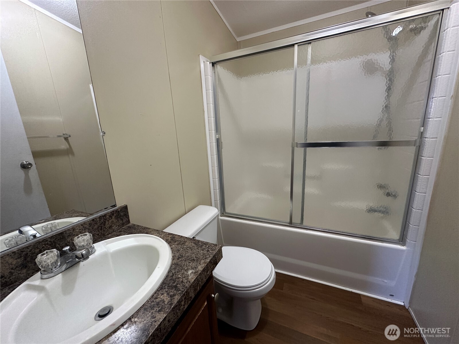 2917 West 19th Avenue, Unit 103 Kennewick, WA 99337 - Photo 9 of 11 a bathroom with a sink and a mirror