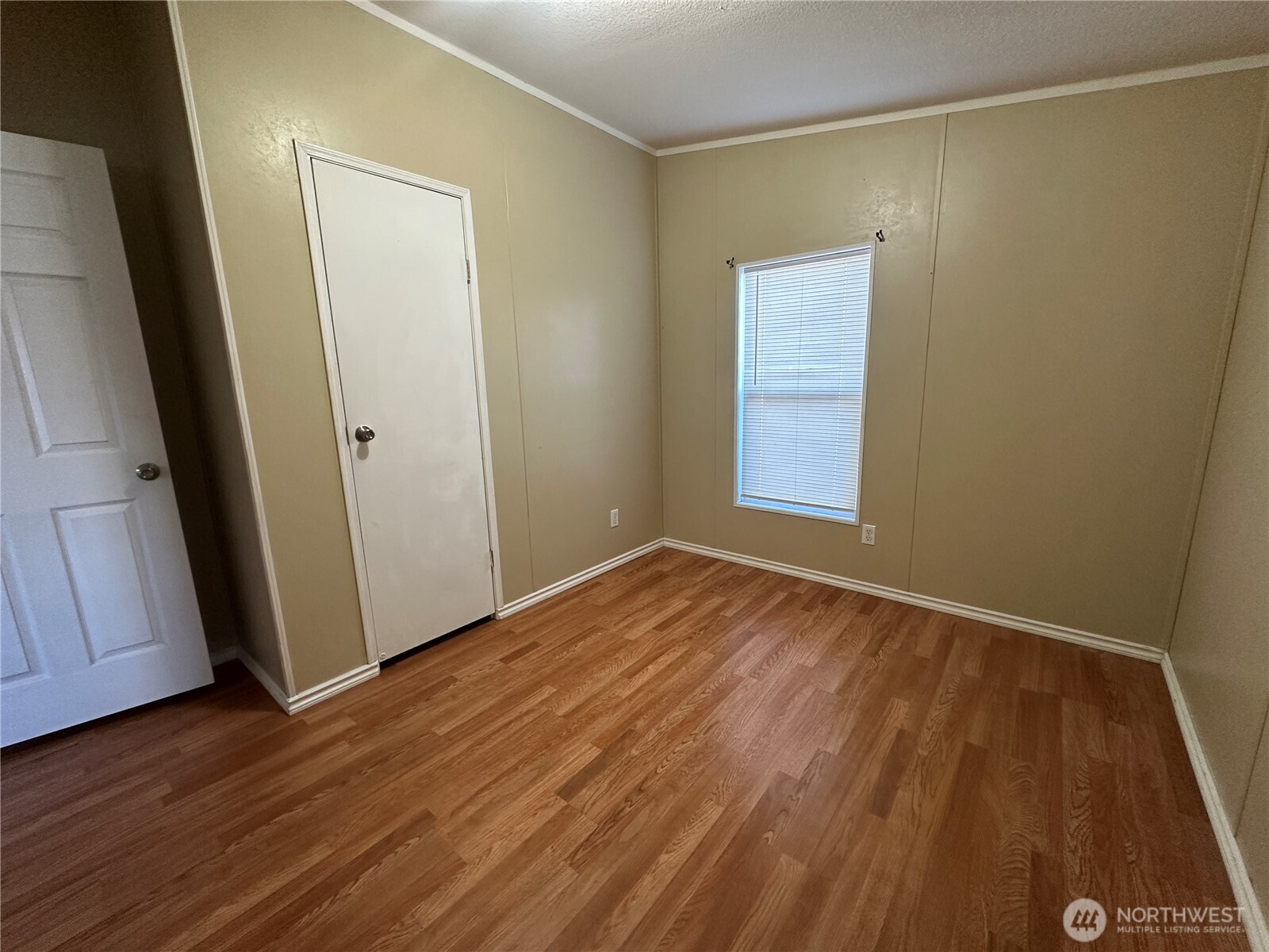 2917 West 19th Avenue, Unit 103 Kennewick, WA 99337 - Photo 10 of 11 a view of empty room with wooden floor and fan