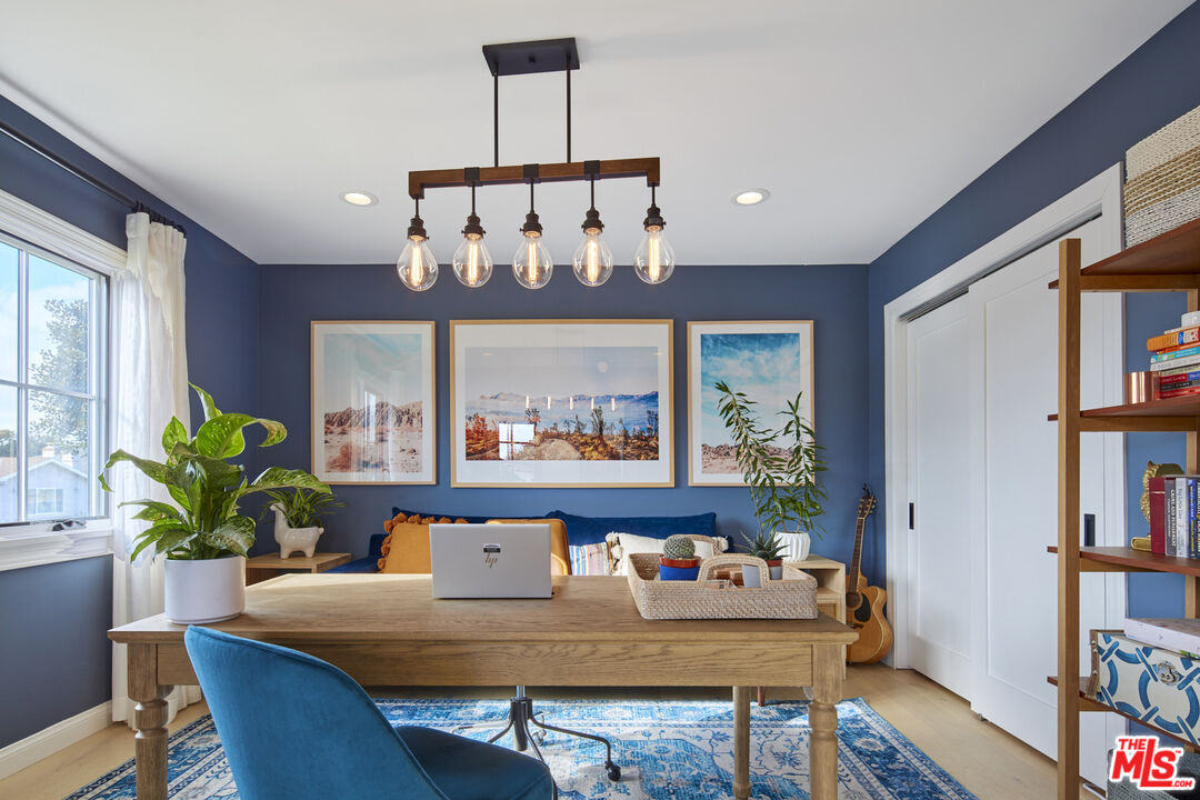 8388 Chase Avenue Los Angeles, CA 90045 - Photo 12 of 30 a view of a dining room with furniture and a potted plant