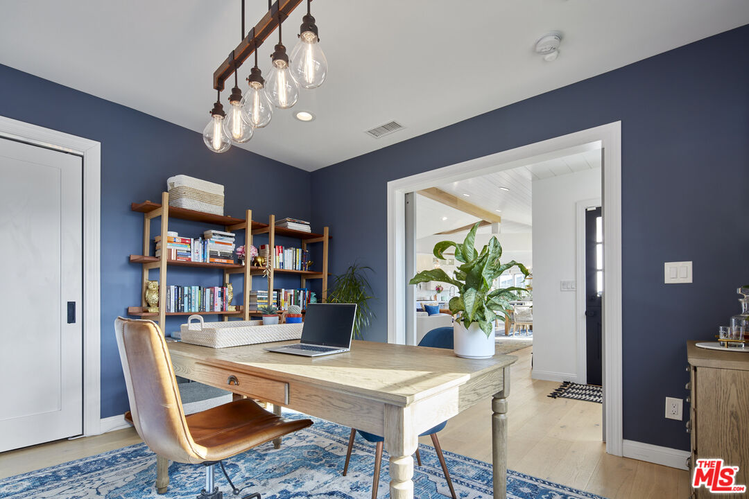 8388 Chase Avenue Los Angeles, CA 90045 - Photo 13 of 30 a workspace with furniture and a potted plant