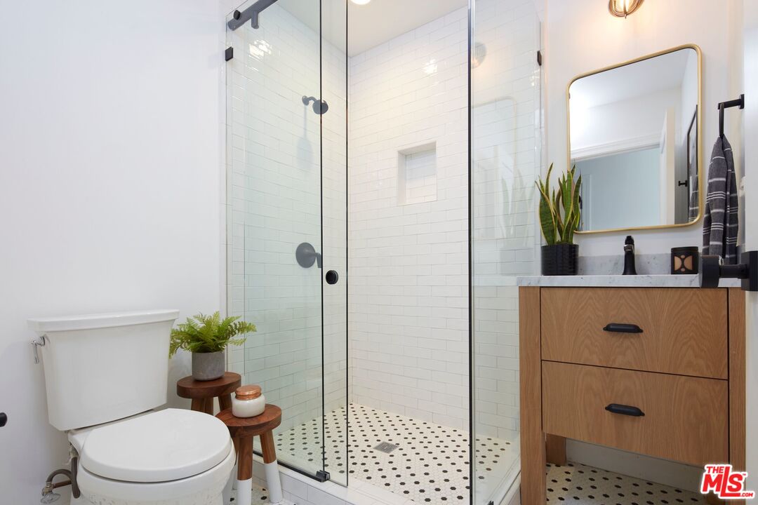8388 Chase Avenue Los Angeles, CA 90045 - Photo 14 of 30 a bathroom with a toilet a sink and shower
