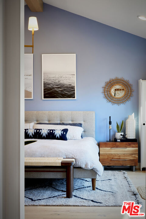 8388 Chase Avenue Los Angeles, CA 90045 - Photo 20 of 30 a bedroom with furniture and a lamp