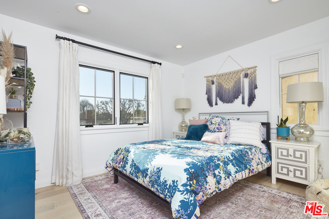 8388 Chase Avenue Los Angeles, CA 90045 - Photo 24 of 30 a bedroom with a large bed and a window